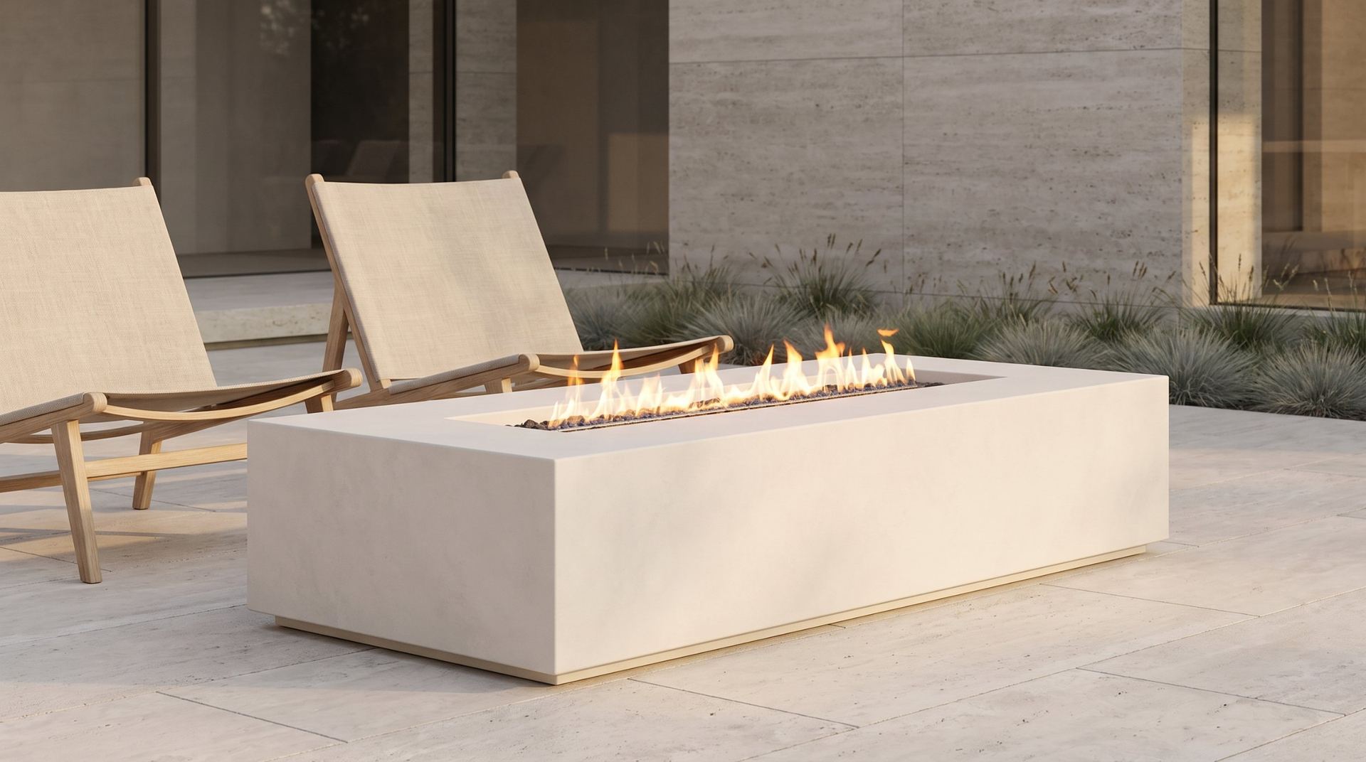 Concrete fire table beside lounge chairs