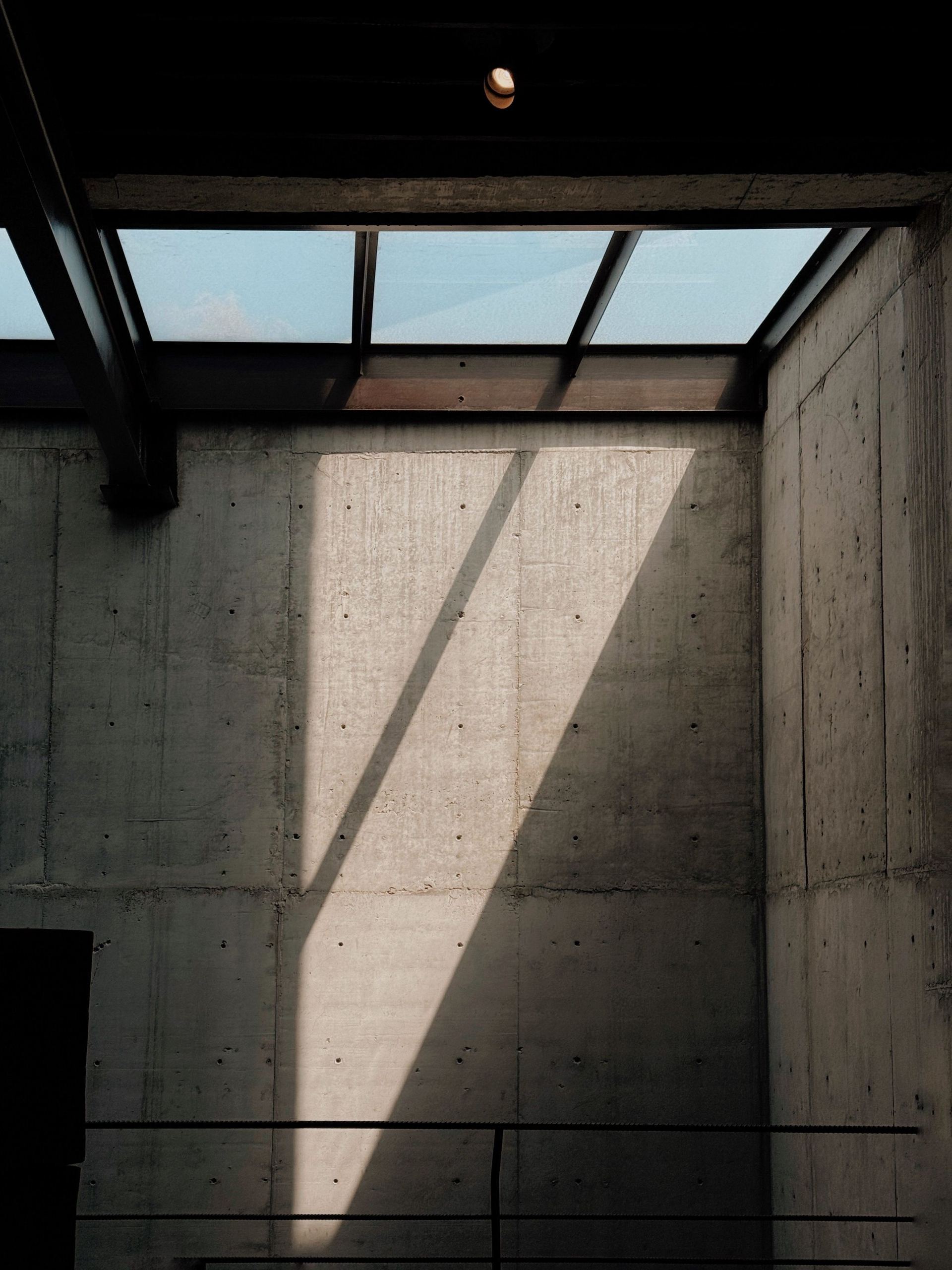 Light falling across a board-formed concrete wall